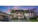 Attractive two-story condo building with lush landscaping and covered parking at 1401 Cordova Grn, Seminole, FL 33777