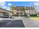 Front view of the two-story building with parking at 1401 Cordova Grn, Seminole, FL 33777