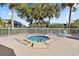 Community hot tub with surrounding patio and landscaping at 1401 Cordova Grn, Seminole, FL 33777