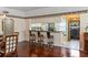 Kitchen with breakfast bar and view into the dining area at 1401 Cordova Grn, Seminole, FL 33777