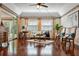 Relaxing living room featuring hardwood floors and sliding glass doors at 1401 Cordova Grn, Seminole, FL 33777