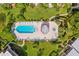 Overhead view of community pool, spa, and surrounding deck at 1401 Cordova Grn, Seminole, FL 33777