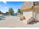 Partial view of the community pool and surrounding patio at 1401 Cordova Grn, Seminole, FL 33777