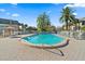 Community pool with lounge chairs, umbrellas, and surrounding patio at 1401 Cordova Grn, Seminole, FL 33777