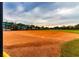 Community baseball field with home plate and dugouts at 15731 Crystal Waters Dr, Wimauma, FL 33598