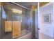 Clean bathroom with a glass shower door and tiled walls at 15731 Crystal Waters Dr, Wimauma, FL 33598