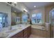 Spa-like bathroom with double sinks, a garden tub, and a walk-in shower at 15731 Crystal Waters Dr, Wimauma, FL 33598