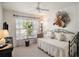 Bedroom with daybed, window, and ceiling fan at 15731 Crystal Waters Dr, Wimauma, FL 33598