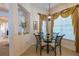 Breakfast nook with glass table and neutral decor at 15731 Crystal Waters Dr, Wimauma, FL 33598