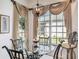 Breakfast nook with glass-top table and window seat at 15731 Crystal Waters Dr, Wimauma, FL 33598
