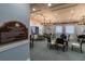Community card room with tables and chairs at 15731 Crystal Waters Dr, Wimauma, FL 33598