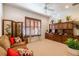 Relaxing den with comfortable seating and built-in shelving at 15731 Crystal Waters Dr, Wimauma, FL 33598