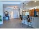 Elegant entryway with tile floors and view into the kitchen at 15731 Crystal Waters Dr, Wimauma, FL 33598