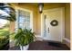 Front door with wreath and brick walkway at 15731 Crystal Waters Dr, Wimauma, FL 33598