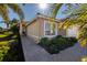 Front entry of home with landscaped walkway at 15731 Crystal Waters Dr, Wimauma, FL 33598