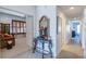 Bright hallway with decorative console table and mirror at 15731 Crystal Waters Dr, Wimauma, FL 33598