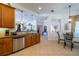 Island kitchen with stainless steel appliances and granite countertops at 15731 Crystal Waters Dr, Wimauma, FL 33598