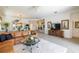 Spacious living area showcasing a leather sectional sofa and access to other rooms at 15731 Crystal Waters Dr, Wimauma, FL 33598