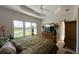 Spacious main bedroom with king bed, plantation shutters and large wardrobe at 15731 Crystal Waters Dr, Wimauma, FL 33598