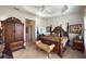 Luxurious main bedroom with king bed, plantation shutters, and ample natural light at 15731 Crystal Waters Dr, Wimauma, FL 33598