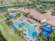 Large community pool and clubhouse aerial view at 15731 Crystal Waters Dr, Wimauma, FL 33598