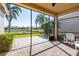Spacious screened-in porch with lake view and brick pavers at 15731 Crystal Waters Dr, Wimauma, FL 33598