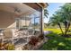 Screened patio with brick pavers, overlooking a lake at 15731 Crystal Waters Dr, Wimauma, FL 33598