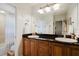Modern bathroom with double vanity and granite countertop at 1655 Canopy Oaks Blvd, Palm Harbor, FL 34683