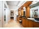 Large bathroom with double vanity and granite countertops at 1655 Canopy Oaks Blvd, Palm Harbor, FL 34683