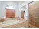 Relaxing bathroom with soaking tub and walk-in shower at 1655 Canopy Oaks Blvd, Palm Harbor, FL 34683