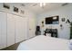 Spacious bedroom with large closet and tv at 1655 Canopy Oaks Blvd, Palm Harbor, FL 34683