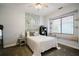 Charming bedroom with window seat and decorative wall at 1655 Canopy Oaks Blvd, Palm Harbor, FL 34683