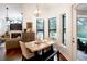 Bright breakfast nook with wood table, pool view at 1655 Canopy Oaks Blvd, Palm Harbor, FL 34683