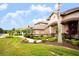 House exterior with a nicely landscaped front yard at 1655 Canopy Oaks Blvd, Palm Harbor, FL 34683