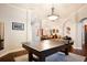 Game room with ping pong table and hardwood floors at 1655 Canopy Oaks Blvd, Palm Harbor, FL 34683