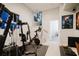 Home gym with various exercise equipment, including a stationary bike and weight machine at 1655 Canopy Oaks Blvd, Palm Harbor, FL 34683