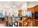 Gourmet kitchen with island and stainless steel appliances at 1655 Canopy Oaks Blvd, Palm Harbor, FL 34683