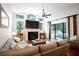 Comfortable living room with fireplace and pool access at 1655 Canopy Oaks Blvd, Palm Harbor, FL 34683