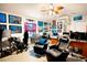 Spacious home office featuring two comfortable chairs and a gaming setup at 1655 Canopy Oaks Blvd, Palm Harbor, FL 34683