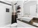 Modern bathroom with granite countertop, white vanity, and shower/tub combo at 17706 1St E St, Redington Shores, FL 33708