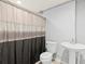 Basement bathroom with pedestal sink and shower/tub combo at 17706 1St E St, Redington Shores, FL 33708