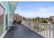 Deck with rocking chairs and a table overlooking the street at 17706 1St E St, Redington Shores, FL 33708