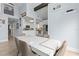 Modern dining area with white table and neutral chairs at 17706 1St E St, Redington Shores, FL 33708