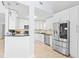Modern kitchen with stainless steel appliances and white shaker cabinets at 17706 1St E St, Redington Shores, FL 33708