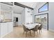 Bright kitchen and dining area with stainless steel appliances and white cabinetry at 17706 1St E St, Redington Shores, FL 33708
