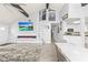 Open living area with a spiral staircase and fireplace at 17706 1St E St, Redington Shores, FL 33708