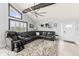 Living Room with sectional sofa, large window, and ceiling fan at 17706 1St E St, Redington Shores, FL 33708