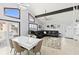 Open living area featuring a sectional sofa and modern dining table at 17706 1St E St, Redington Shores, FL 33708