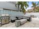 Outdoor patio with lounge seating, gas grill, and plenty of space at 17706 1St E St, Redington Shores, FL 33708