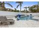 Relaxing pool area with lounge chairs and basketball hoop at 17706 1St E St, Redington Shores, FL 33708